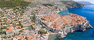 Aerial panorama drone shot of old town Dubrovnik by Adriatic sea in Croatia summer noon