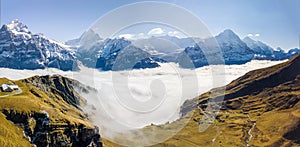 Aerial panorama of the First peak in Grindelwald with rising aut