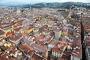 Aerial panorama of Florence old town from the top of Florence Cathedral Il Duomo di Firenze with a view of crowded houses