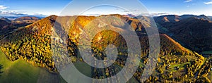 Aerial panorama of forested hills and mountains at sunset, Slovakia mountain forest ladscape