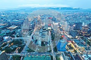 Aerial panorama form Taipei 101 Tower over Taipei City in evening twilight, with view of XinYi Commercial area and downtown under