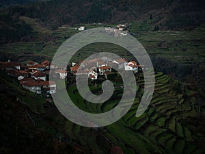 Aerial panorama of green agriculture farming terraces old remote rural mountain village town Padrao Portugal