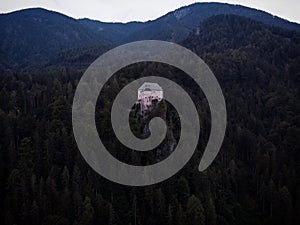 Aerial panorama of idyllic medieval historic stone rock hill cliff edge castle Schloss Stein in Dellach Kaernten Austria