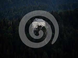 Aerial panorama of idyllic medieval historic stone rock hill cliff edge castle Schloss Stein in Dellach Kaernten Austria