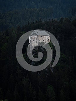 Aerial panorama of idyllic medieval historic stone rock hill cliff edge castle Schloss Stein in Dellach Kaernten Austria