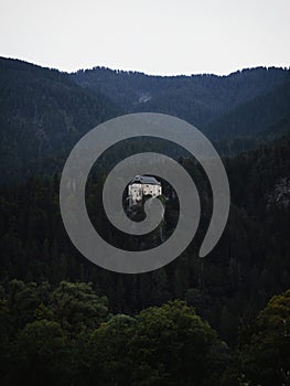 Aerial panorama of idyllic medieval historic stone rock hill cliff edge castle Schloss Stein in Dellach Kaernten Austria