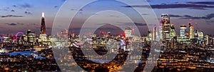 Aerial panorama of the illuminated skyline of London, UK