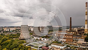 Aerial panorama of industrial area with smoke from chimneys of thermal power plant or station