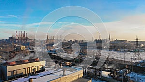 Aerial panorama of industrial buildings, lot of workplaces and developed infrastructure of plant, in contrast