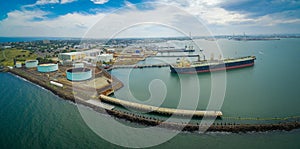 Aerial panorama of large industrial nautical vessel moored at docks in Williamstown, Melbourne, Australia.