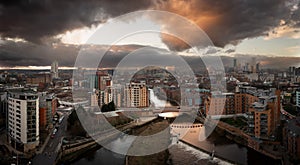 Aerial panorama of Leeds Dock and River Aire in a cityscape skyline at sunrise