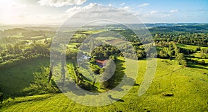 ÃÅeadows and pastures at sunset.