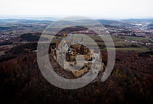 Aerial panorama of medieval gothic mountain hilltop castle Burg Hohenzollern Hechingen Swabian Jura alps autumn Germany
