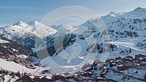 Aerial panorama of Meribel village, on the end of the valley in the french Alps. Beautiful panorama of ski slopes and chalets with