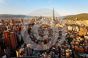 Aerial panorama over Downtown Taipei, capital city of Taiwan with view of prominent Taipei 101 Tower amid skyscrapers