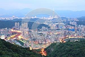 Aerial panorama of overpopulated suburban communities in Taipei at dusk