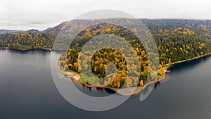 Aerial panorama photo of Cultus Lake during autumn when the fall foliage on the surrounding mountains at its best in Chilliwack, B