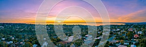 Aerial panorama of Port Phillip Bay and Frankston suburb at sunset.