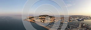 Aerial panorama of the port of SÃ¨te and Mont Saint Clair, at sunrise, in the HÃ©rault department in Occitanie, France