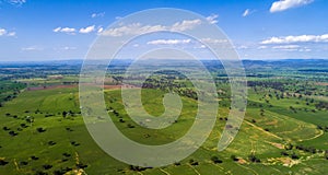 Aerial panorama of rural green fields and pastures on a sunny day in Australia