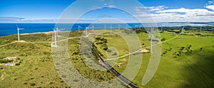 Aerial panorama of rural road and wind farm in Australia.