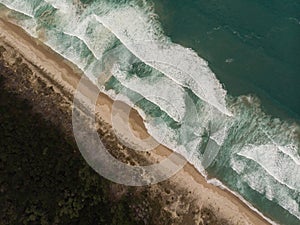 Aerial panorama of sand coast pacific ocean sea shore Opoutere beach waves Waikato Coromandel Peninsula New Zealand