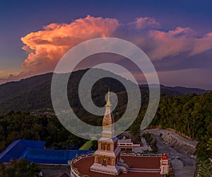 aerial panorama scenery sunset over pagoda of Doi Thepnimit temple on the highest of Patong mountain