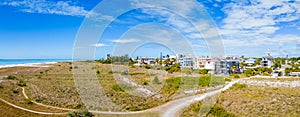 Aerial panorama Siesta Key dunes with beachfront homes under construction