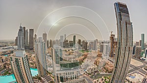 Aerial panorama with sunrise over big futuristic city timelapse. Business bay and Downtown
