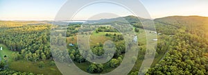 Aerial panorama of sunset over rural area.