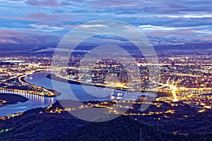 Aerial panorama of Taipei City in a misty gloomy night