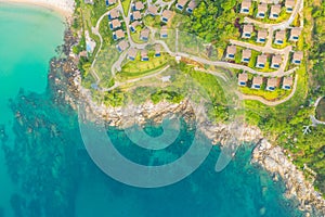 Aerial panorama of tropical resort territory and beach, beautiful Andaman sea at west coast of Phuket Island. Kata Noi beach from