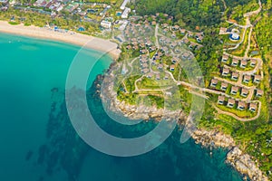 Aerial panorama of tropical resort territory and beach, beautiful Andaman sea at west coast of Phuket Island. Kata Noi beach from