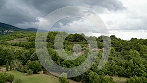 Aerial Panorama between Vaugines and Cucuron: Cloudy Skies Over Ancient and New Forests in PACA, Provence