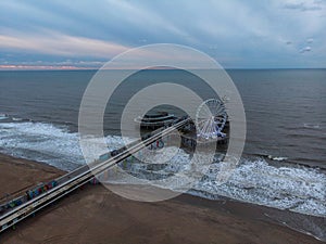 Aerial panorama view of amusement park attractions on beach pier of Scheveningen The Hague Den Haag Netherlands Holland