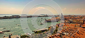 Aerial panorama view of Basilica of Santa Maria della Salute against dramatic sky during day time, located at Punta della Dogana