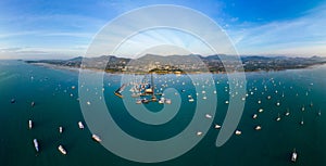 Aerial panorama view of Chalong pier with many boats at sunrise, Phuket, Thailand