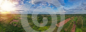 Aerial panorama view of countryside with windmills, Agriculture fields and different variety of harvest, Panaramic view of forest