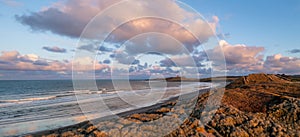 Aerial panorama view of Embleton Bay and Dunstanburgh Castle