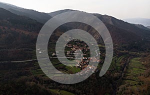 Aerial panorama view of green agriculture farming terraces in remote rural mountain village town Sistelo Norte Portugal