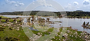 Aerial panorama view of the historic Ponte de Ajuda bridge over the Guadiana River photo