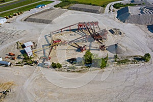 Aerial panorama view of open quarries mining mine extracting with work of machinery equipment