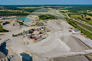 Aerial panorama view of open quarries mining mine extracting with work of machinery equipment