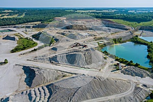 Aerial panorama view of open quarries mining mine extracting with work of machinery equipment