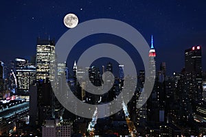 Aerial and panorama view of skyscrapers of New York City, Manhattan. view of night midtown of Manhattan with stars and moon