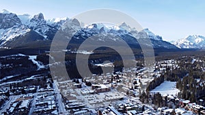 Aerial panorama view of Town of Canmore and Canadian Rockies in winter. Alberta, Canada