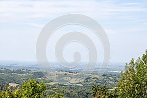 Aerial panoramal of Novi Sad, seen from a hill of Fruska Gora National park during a summer afternoon.