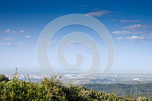 Aerial panoramal of Novi Sad, seen from a hill of Fruska Gora National park during a summer afternoon. Novi Sad is the capital