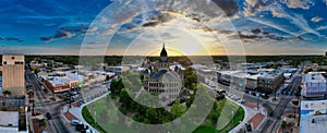 Aerial panoramic of the Denton County Courthouse Museum around the streets and buildings in Texas