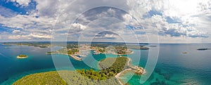 Aerial panoramic drone picture of Vrsar harbour in Croatia with turquoise water during daytime